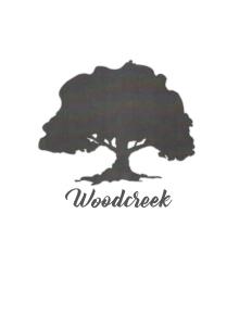 WoodCreek Cares Charity 5k & Fun Run logo